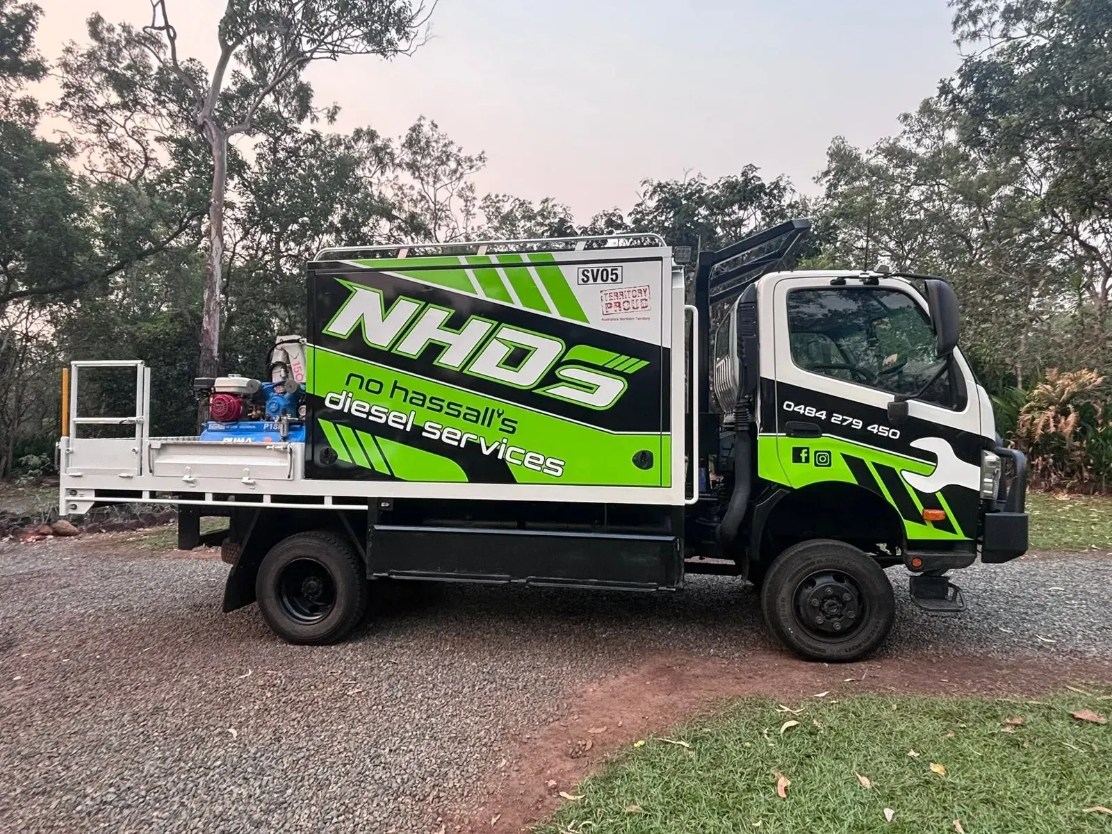 No Hassall’s Diesel Services truck with crane and service body parked on gravel