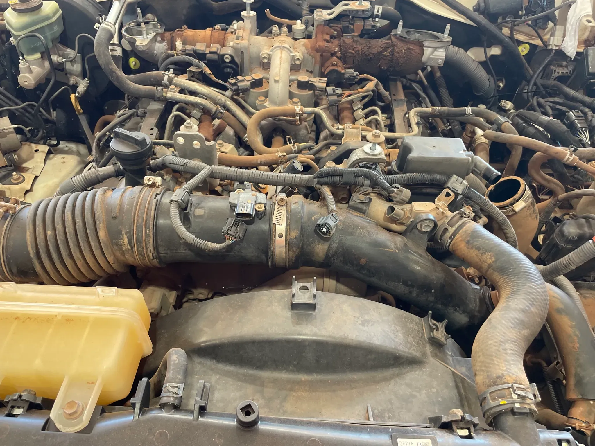 Toyota V8 diesel engine bay during repairs